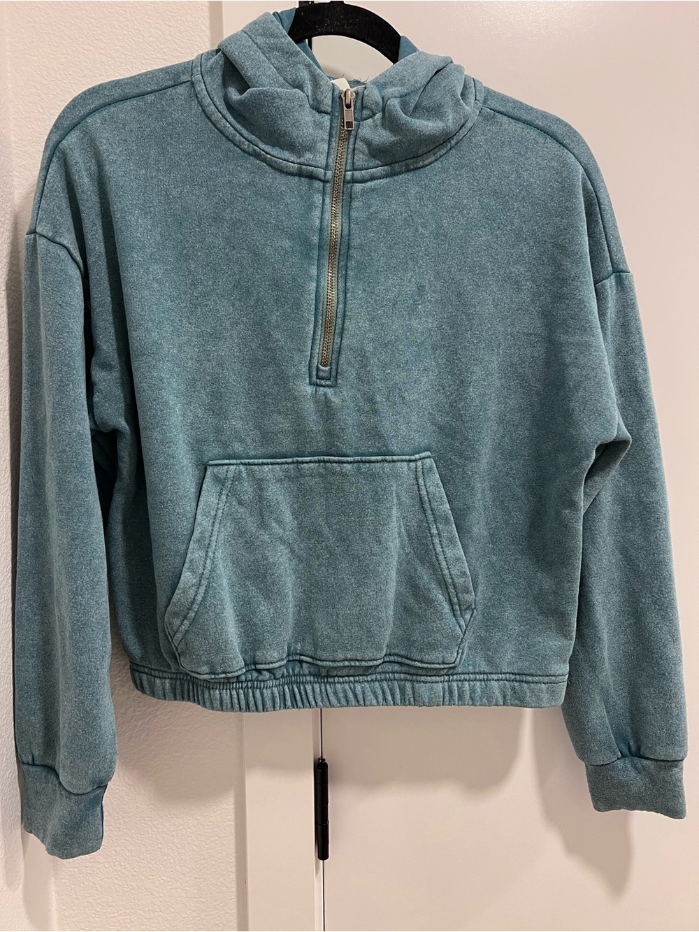 Junior turquoise crop sweater with zipper pockets